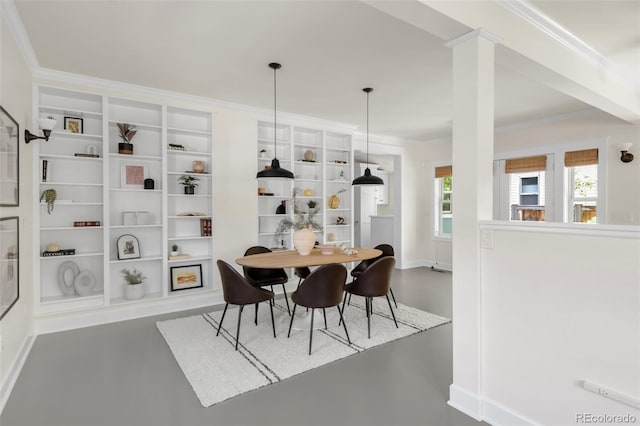 539 Baker St, Longmont, CO 80501 - dining space featuring crown molding and built in shelves