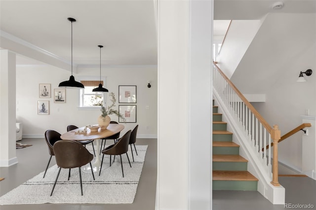 539 Baker St, Longmont, CO 80501 - dining space with ornamental molding, stairs, and baseboards