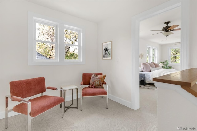 539 Baker St, Longmont, CO 80501 - living area featuring baseboards and light carpet
