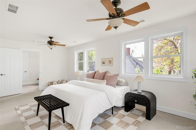 539 Baker St, Longmont, CO 80501 - bedroom featuring light carpet, baseboards, and a ceiling fan