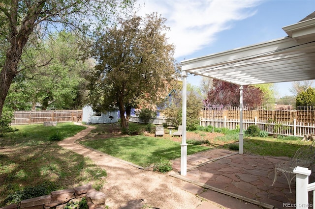 539 Baker St, Longmont, CO 80501 - view of yard with a patio, a storage shed, an outdoor structure, and a pergola