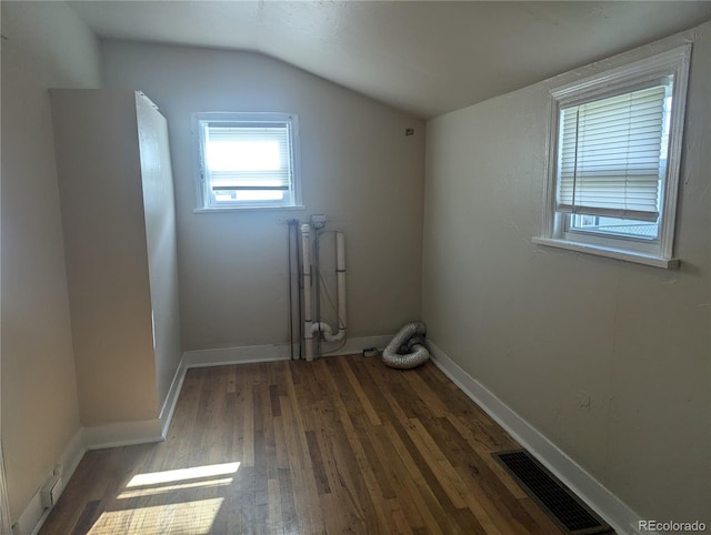 washroom with radiator and dark wood-type flooring