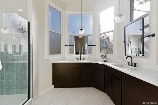 bathroom with tile patterned floors, vanity, and walk in shower