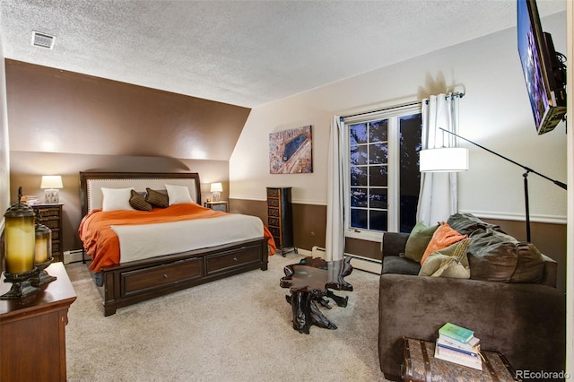 carpeted bedroom with a baseboard radiator, lofted ceiling, and a textured ceiling