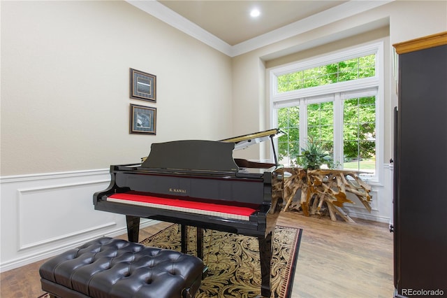 misc room featuring hardwood / wood-style floors and ornamental molding