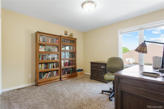 home office featuring visible vents, baseboards, and carpet floors