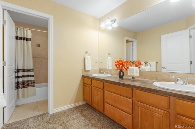 full bathroom featuring tile patterned flooring, double vanity, shower / bath combination with curtain, and a sink