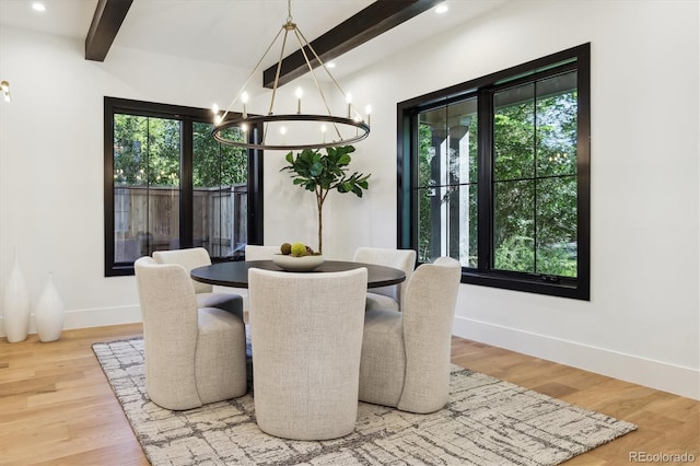 dining area featuring a notable chandelier, beamed ceiling, and wood-type flooring