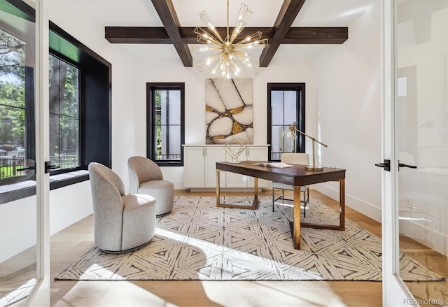 office area featuring french doors, beam ceiling, a notable chandelier, coffered ceiling, and light hardwood / wood-style floors