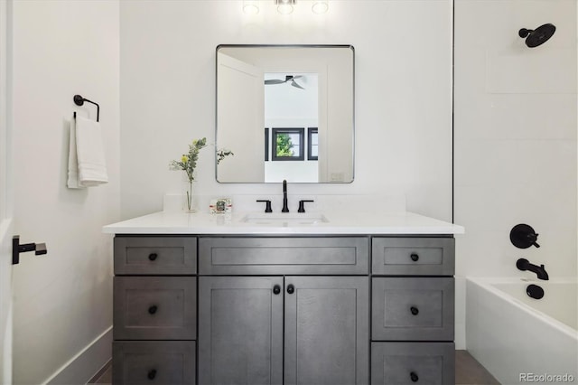 bathroom with vanity and  shower combination