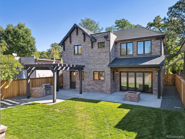 back of property featuring area for grilling, a fire pit, a patio, and a lawn