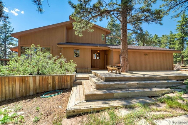 view of front of home with a wooden deck