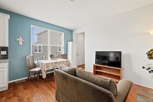 living room with dark hardwood / wood-style floors