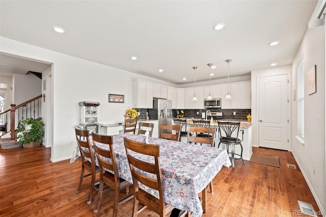 dining room with light wood-type flooring