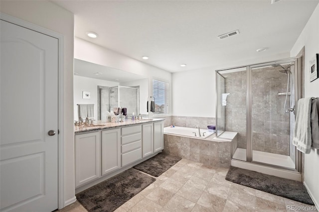 bathroom with vanity, independent shower and bath, and tile patterned floors