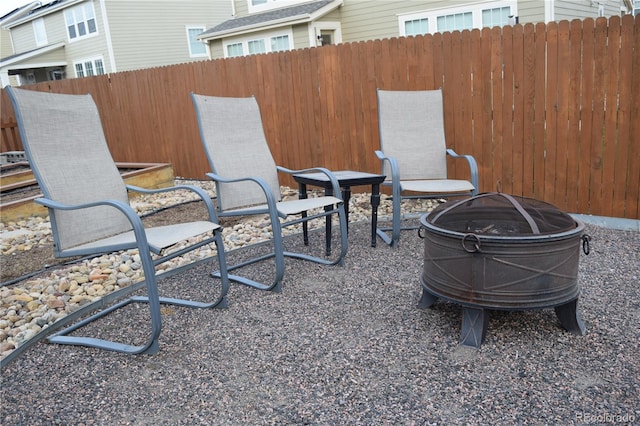 view of patio with a fire pit