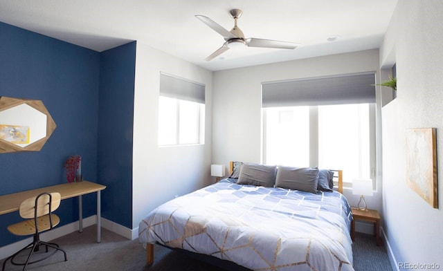 bedroom with ceiling fan and carpet flooring