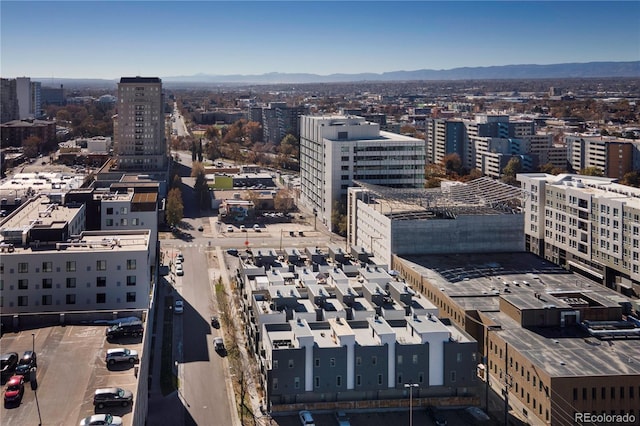 property's view of city featuring a mountain view