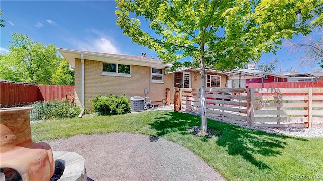 8774 Princeton St, Westminster, CO 80031 - back of house featuring brick siding and central AC unit