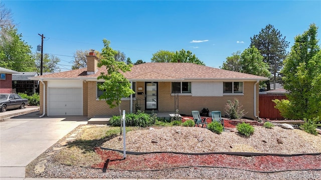 8774 Princeton St, Westminster, CO 80031 - single story home featuring an attached garage, driveway, a chimney, brick siding, and roof with shingles