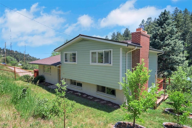 570 Columbine Ave, Golden, CO 80401 - rear view of property featuring a chimney
