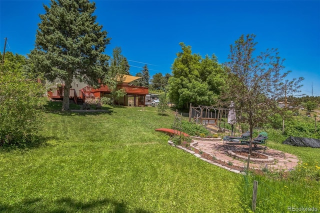 570 Columbine Ave, Golden, CO 80401 - view of grassy yard featuring a deck