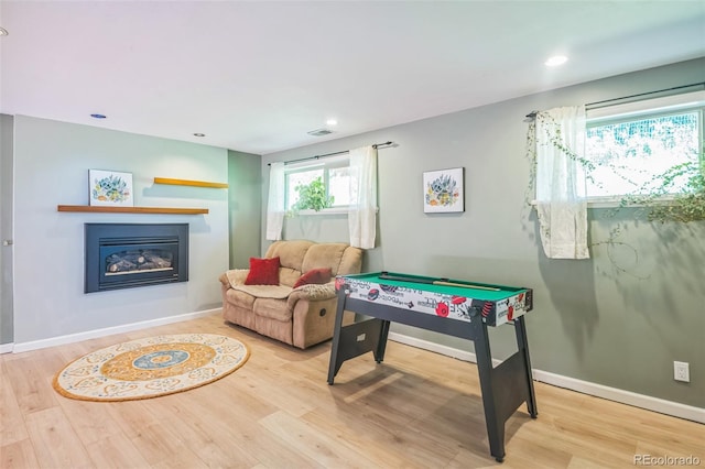 570 Columbine Ave, Golden, CO 80401 - game room with wood finished floors, a glass covered fireplace, recessed lighting, and billiards