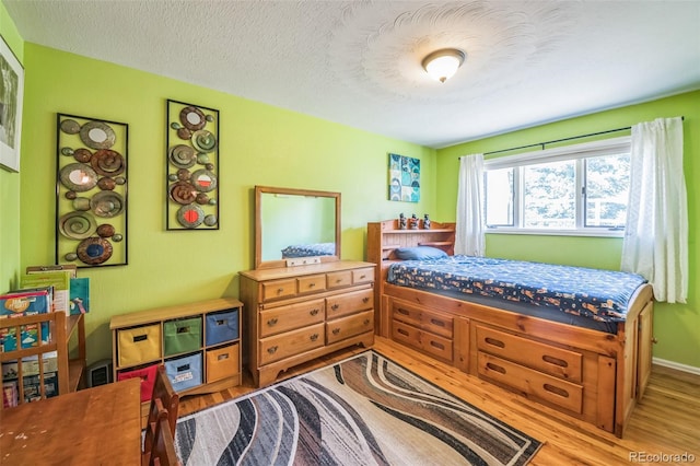 570 Columbine Ave, Golden, CO 80401 - bedroom featuring wood finished floors and a textured ceiling