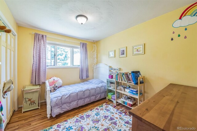 570 Columbine Ave, Golden, CO 80401 - bedroom featuring wood finished floors