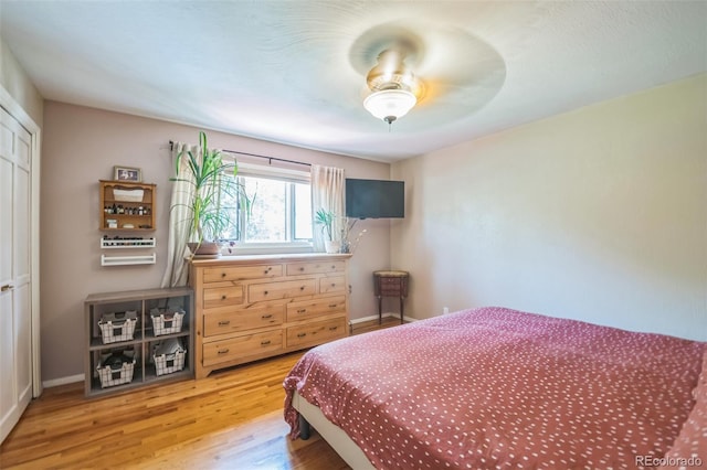 570 Columbine Ave, Golden, CO 80401 - bedroom with light wood finished floors and a ceiling fan
