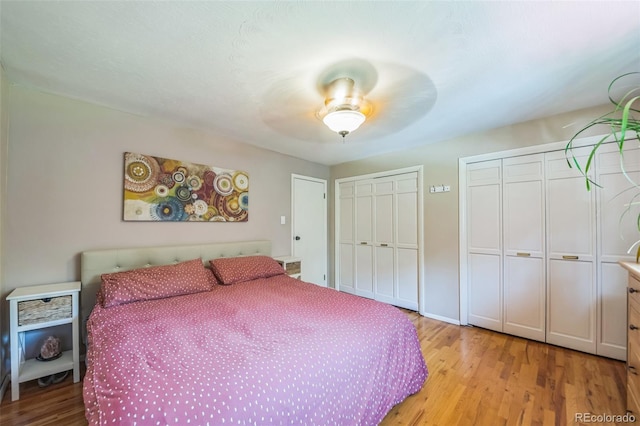 570 Columbine Ave, Golden, CO 80401 - bedroom featuring multiple closets, wood finished floors, and a ceiling fan