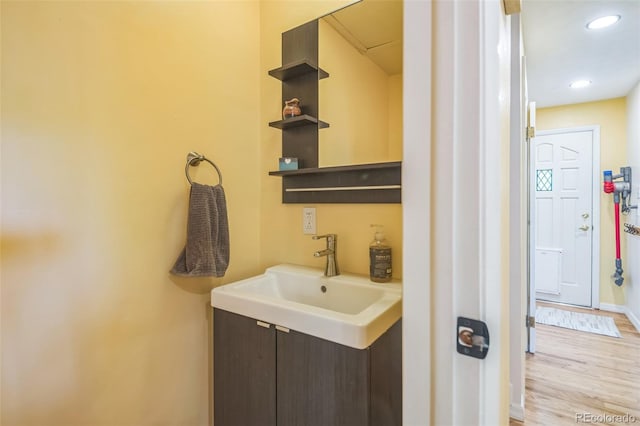 570 Columbine Ave, Golden, CO 80401 - bathroom with wood finished floors, recessed lighting, and vanity