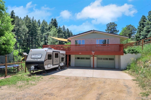570 Columbine Ave, Golden, CO 80401 - view of front of home with concrete driveway and a garage