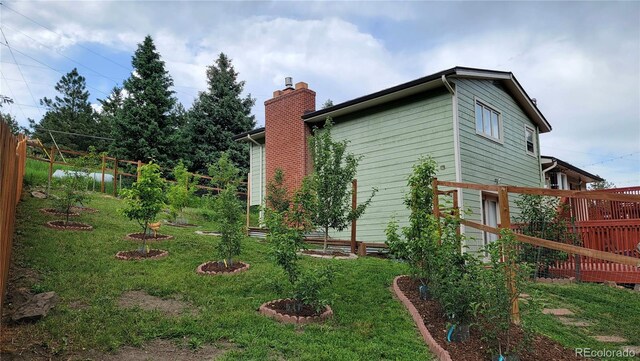 570 Columbine Ave, Golden, CO 80401 - view of home's exterior featuring a chimney