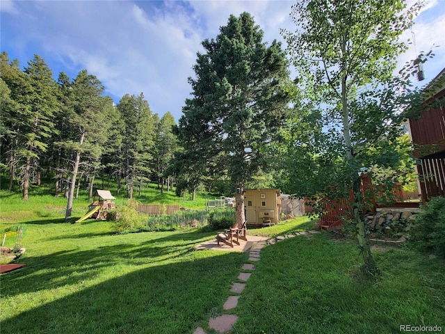 570 Columbine Ave, Golden, CO 80401 - view of grassy yard with a playground and a shed