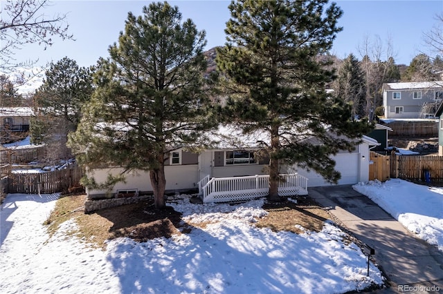 view of front of house featuring covered porch and a garage