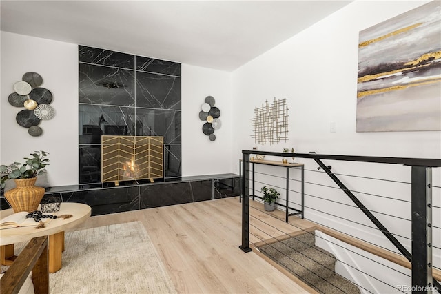 interior space featuring a premium fireplace and wood-type flooring