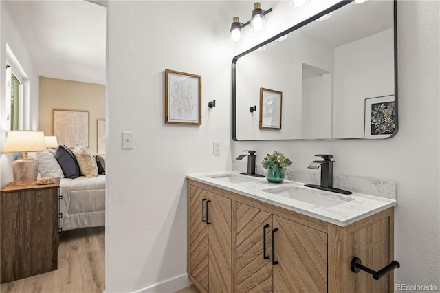 bathroom with vanity and hardwood / wood-style floors