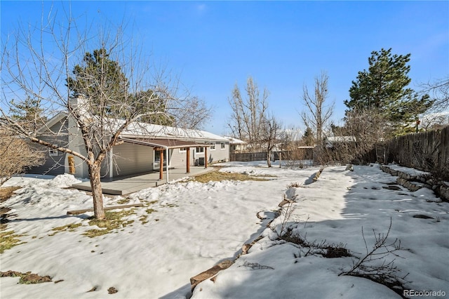 view of yard layered in snow