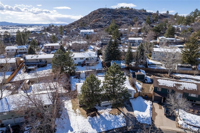 snowy aerial view with a mountain view