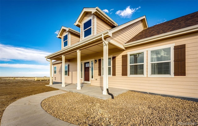 view of front of property featuring covered porch