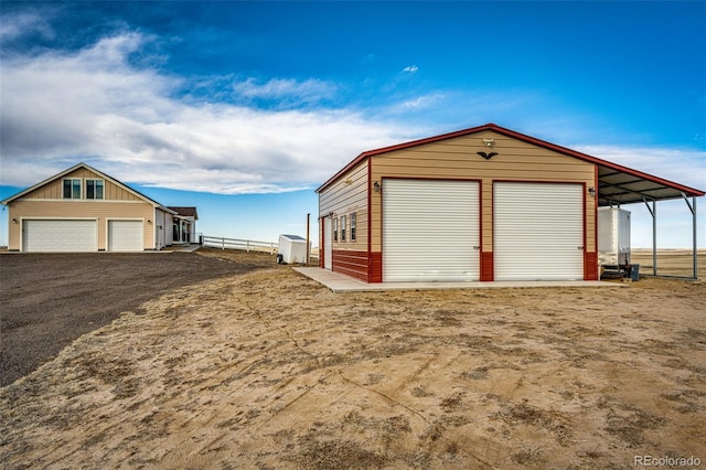 garage with a garage and fence