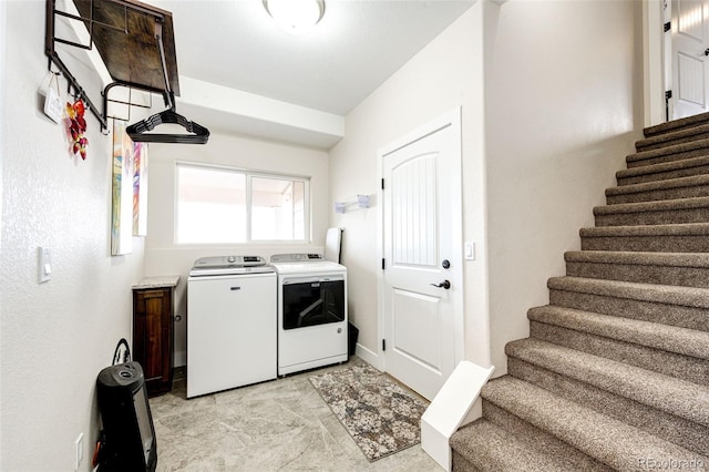 laundry room featuring separate washer and dryer