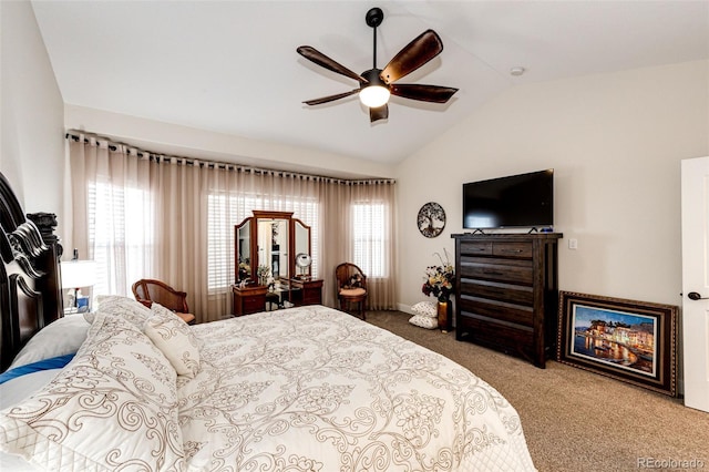 bedroom with lofted ceiling, carpet floors, and a ceiling fan