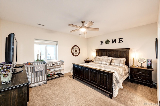 bedroom featuring carpet, visible vents, and a ceiling fan