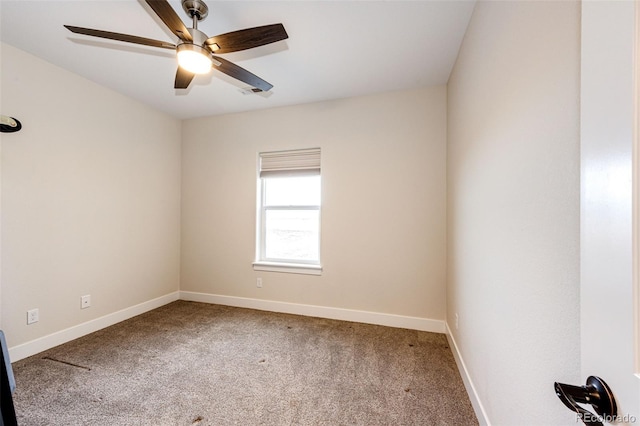 unfurnished room featuring carpet flooring, a ceiling fan, and baseboards