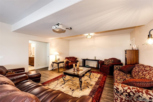 living area with wood finished floors and baseboards