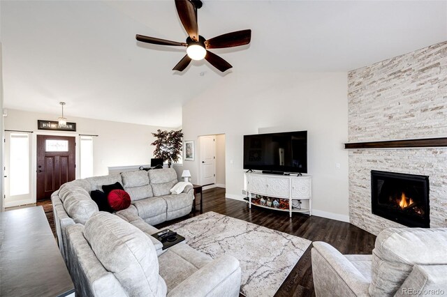 4820 S County Road 137, Bennett, CO 80102 - living area featuring ceiling fan, dark wood-style floors, a fireplace, high vaulted ceiling, and baseboards