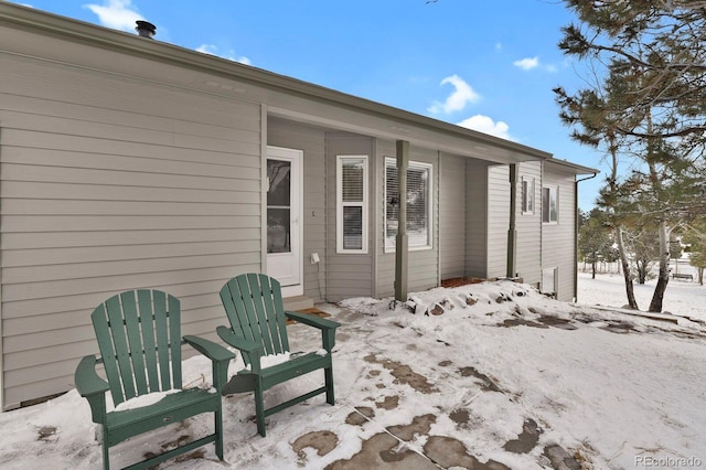 view of snow covered patio