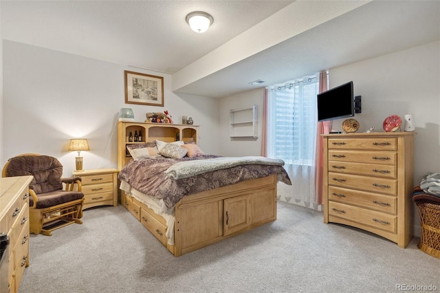 bedroom with light carpet